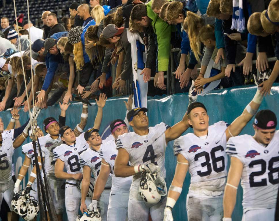 Rick Egan  |  The Salt Lake Tribune

The Brigham Young Cougars celebrate their win over Wyoming in the Poinsettia Bowl, at Qualcomm Stadium in San Diego, December 21, 2016.