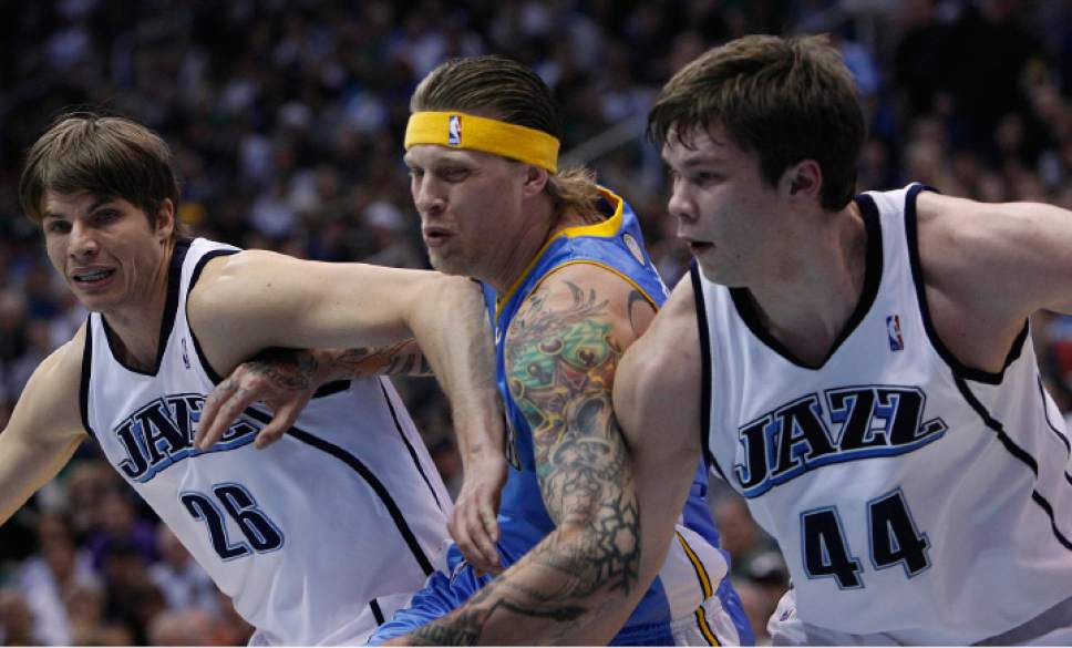 Chris Detrick | The Salt Lake Tribune

Utah Jazz's Kyle Korver (26) and Utah Jazz's Kyrylo Fesenko (44) try to keep Denver Nuggets' Chris Andersen (11) away from the ball as the Jazz face the Nuggets in the fourth game of the first round playoff series at EnergySolutions Arena Friday, April 23, 2010.