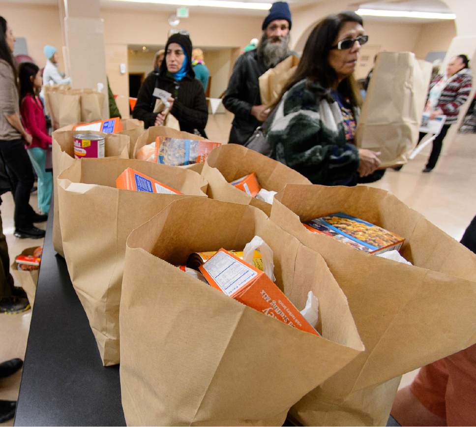 Trent Nelson  |  The Salt Lake Tribune
Food is distributed at the Rowland Hall & Crossroads Urban Center Holiday Meal Giveaway for Utah Families in Need in Salt Lake City, Friday December 23, 2016.