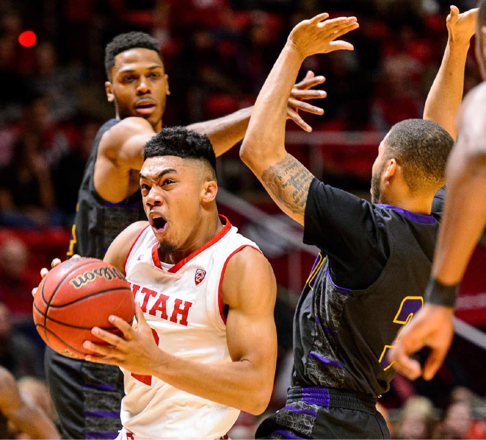 Utah Utes guard Sedrick Barefield (2) drives between Prairie View A&M forward Zachary Hamilton (14) and guard Jordan Giddings (3) as during an NCAA college basketball game in Salt Lake City, Saturday Dec. 17, 2016. (Trent Nelson/The Salt Lake Tribune via AP)