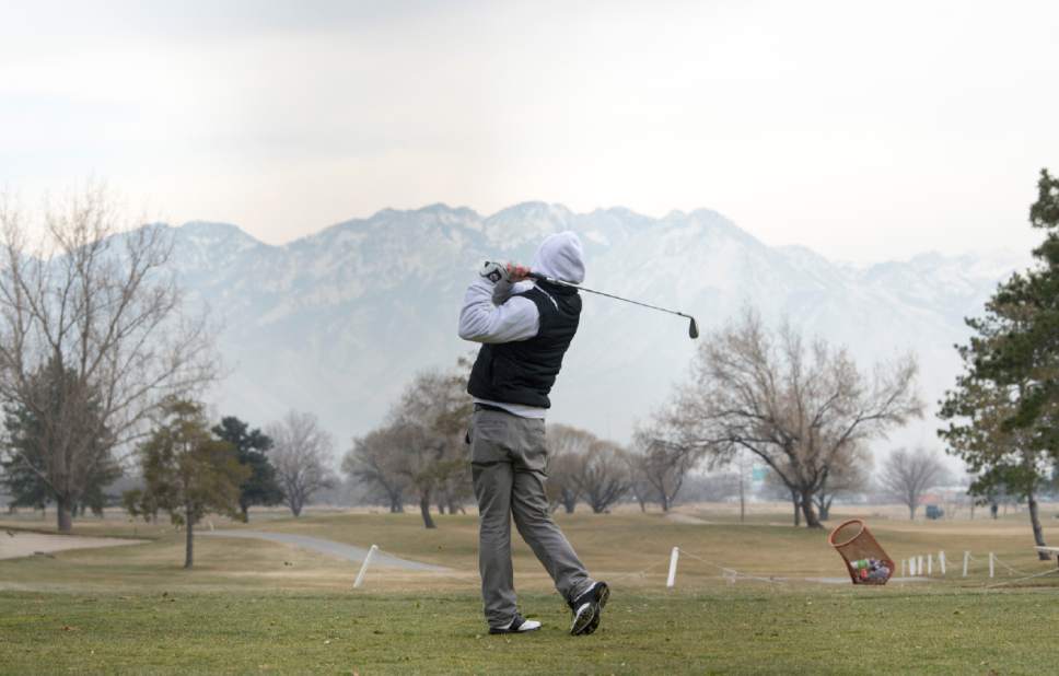 Rick Egan  |  The Salt Lake Tribune
Buddy Johnson tries to squeeze in a round of golf at Glendale Golf Course before the winter storm on Friday.