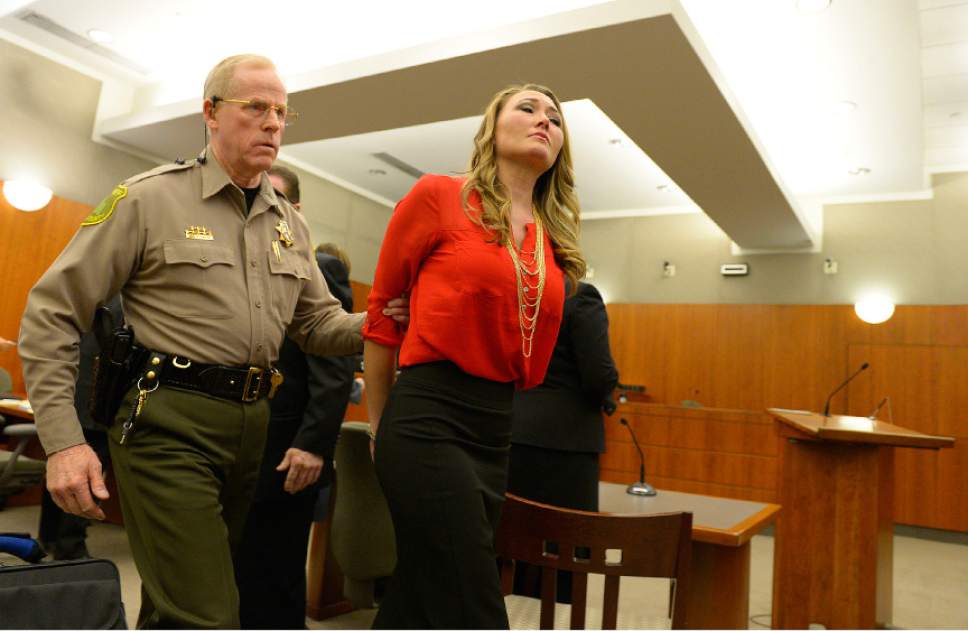 Leah Hogsten  |  The Salt Lake Tribune
Brianne Altice, 35, was taken into custody and ordered to stand trial in 2nd District Court after Judge John R. Morris refused to set bail, Thursday, January 15, 2015. Altice,  is facing a total of 14 felony charges for allegedly having sexual relationships with three male students: five counts of first-degree felony rape, two counts of first-degree felony forcible sodomy, three counts of second-degree felony forcible sexual abuse, along with three counts of unlawful sexual activity with a minor and one count of dealing harmful material to a minor, all third-degree felonies.