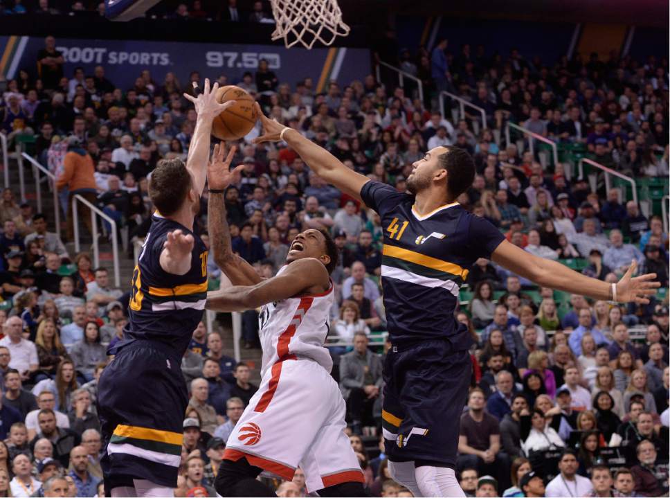 Scott Sommerdorf   |  The Salt Lake Tribune  
Utah Jazz forward Gordon Hayward (20) and Utah Jazz forward Trey Lyles (41) block the shot of Toronto Raptors guard DeMar DeRozan (10) during second half play. The Toronto Raptors beat the Jazz 104-98, Friday, December 23, 2016.