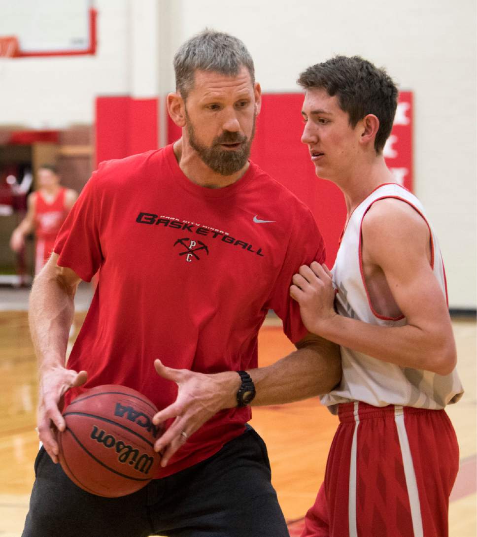 Rick Egan  |  The Salt Lake Tribune

Mike Doleac, former Ute basketball star and NBA veteran, works with Alex Obradovich, as the head coach of the Park City Miners basketball team, during practice, Monday, December 19, 2016.