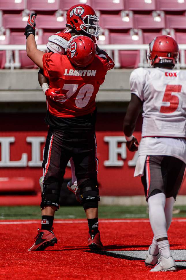 Trent Nelson  |  The Salt Lake Tribune
Jackson Barton (70) celebrates a touchdown with Joe Williams during Utah's second fall scrimmage at Rice-Eccles Stadium in Salt Lake City, Tuesday August 16, 2016.