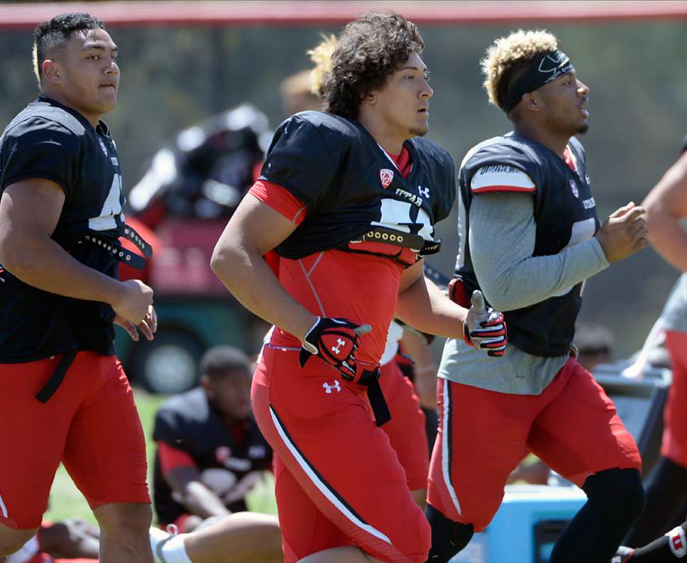 Al Hartmann  |  The Salt Lake Tribune 
Bradlee Anae, center, runs wind sprints at the end of practice Tuesday Aug.9.  He is one of three Ute freshmen defensive-linemen with a lot of talent and promise.