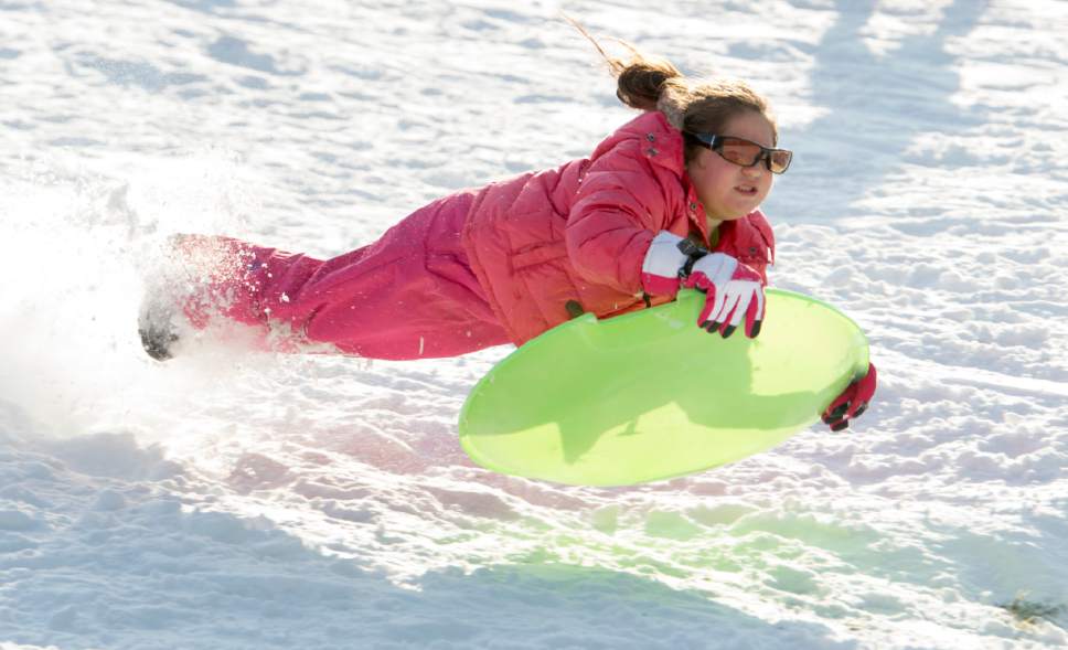 Rick Egan  |  The Salt Lake Tribune

Rashid Escobar, 6, gets some air as she goes off a jump on her sled at Liberty Park, Monday, December 26, 2016.