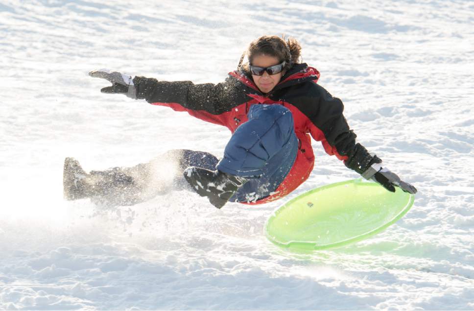 Rick Egan  |  The Salt Lake Tribune

Megan Escobar, 13, gets some air as she goes off a jump on her sled at Liberty Park, Monday, December 26, 2016.
