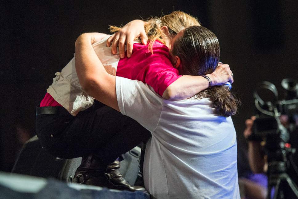 Chris Detrick  |  The Salt Lake Tribune
Carrie Fisher gives a fan a hug after he gave her a coke  during Salt Lake Comic Con FanX at the Salt Palace Convention Center Saturday January 31, 2015.