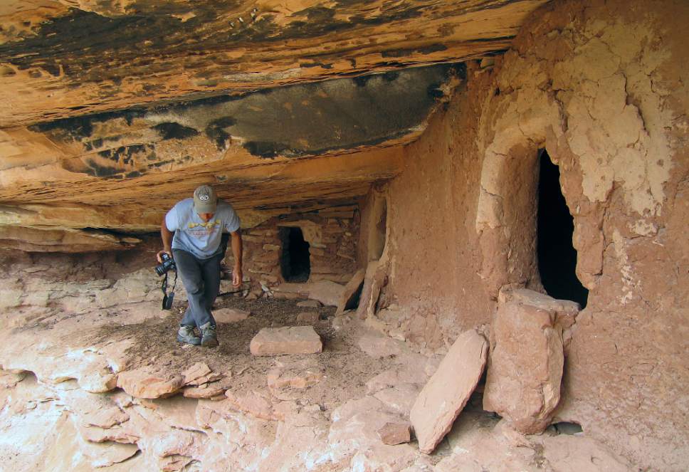 Al Hartmann  |  The Salt Lake Tribune 
Backpacker explores an unknown Anasazi ruin under a sandstone alcove in a canyon on Cedar Mesa in San Juan County.  The area is included for a proposed Bears Ears National Monument.