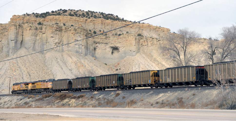 Al Hartmann  |  The Salt Lake Tribune
Union Pacific engines pull coal cars past Carbonville towards Helper. Railroads and coal have had a relationship for decades in supporting the Carbon County economy. With the election of Donald Trump people in Carbon and Emery County are hopeful that the coal industry can be saved.
