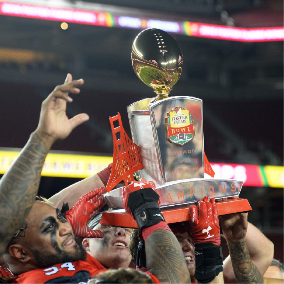 Steve Griffin / The Salt Lake Tribune

The Utah Utes hold up the championship trophy following Utah's victory in the Foster Farms Bowl at Levi's Stadium in Santa Clara California  Wednesday December 28, 2016.