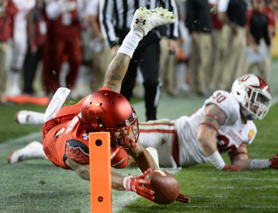 Steve Griffin / The Salt Lake Tribune

Utah Utes running back Troy McCormick (4) dives for the end zone as he stretches with the ball as Indiana Hoosiers defensive back Chase Dutra (30) falls to the ground during the Foster Farms Bowl at Levi's Stadium in Santa Clara California  Wednesday December 28, 2016.