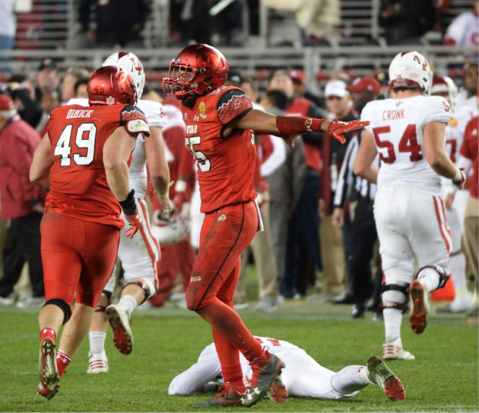 Steve Griffin / The Salt Lake Tribune

Indiana Hoosiers quarterback Richard Lagow (21) lies flat on the ground as Utah Utes linebacker Kavika Luafatasaga (55) signals the end of the game after knocking Lagow to the turf on the last play of the game during the Foster Farms Bowl at Levi's Stadium in Santa Clara California  Wednesday December 28, 2016.