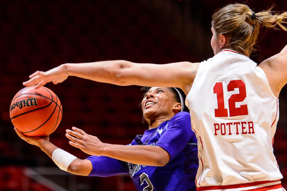 Trent Nelson  |  The Salt Lake Tribune
Weber State Wildcats guard Deeshyra Thomas (2) shoots, with Utah Utes forward Emily Potter (12) defending as University of Utah hosts Weber State, NCAA women's basketball at the Huntsman Center in Salt Lake City, Saturday December 17, 2016.