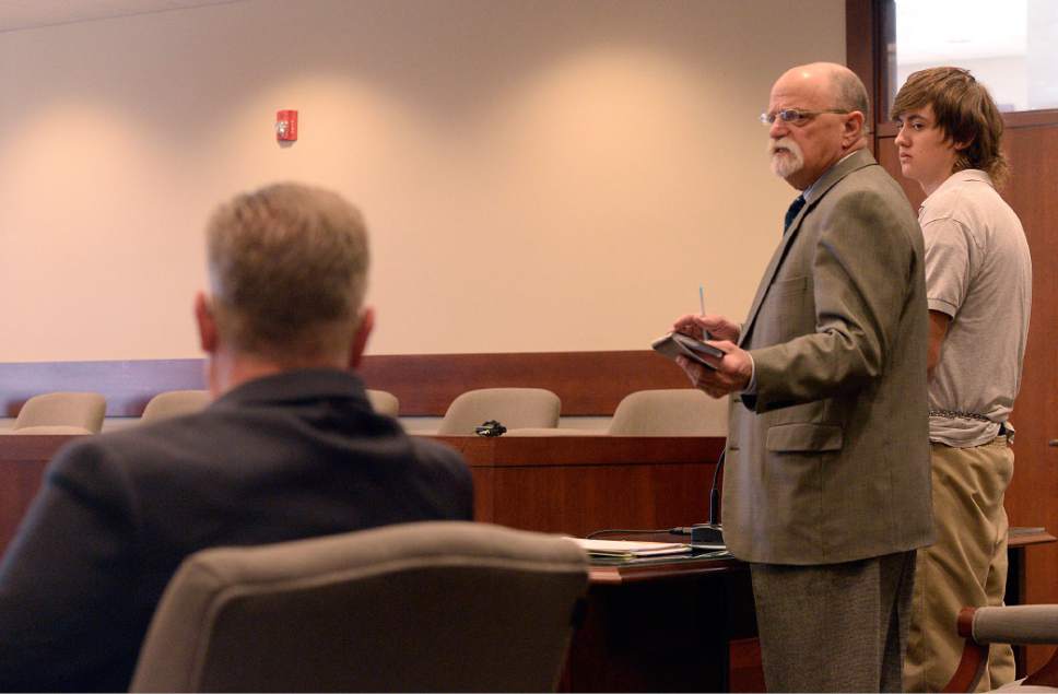 Al Hartmann  |  The Salt Lake Tribune                 
Clay Brewer, 17, of Snowflake, Arizona meets with his defense attorney Ron Yengich in Judge Wallace Lee's 6th District Court in Panguitch Thursday Dec. 29 to make his first court appearance.  Garfield County District Attorney Barry Huntington, left. He is being charge as an adult with first-degree-felony counts of aggravated murder, attempted aggravated murder and aggravated robbery, as well as a third-degree-felony count of failure to stop at the command of police, and misdemeanor counts of tampering with evidence, reckless endangerment, theft and reckless driving. He is accused of killing 61-year-old Jimmy Woolsey during an attack at Turn-About Ranch School, located north of Escalante.