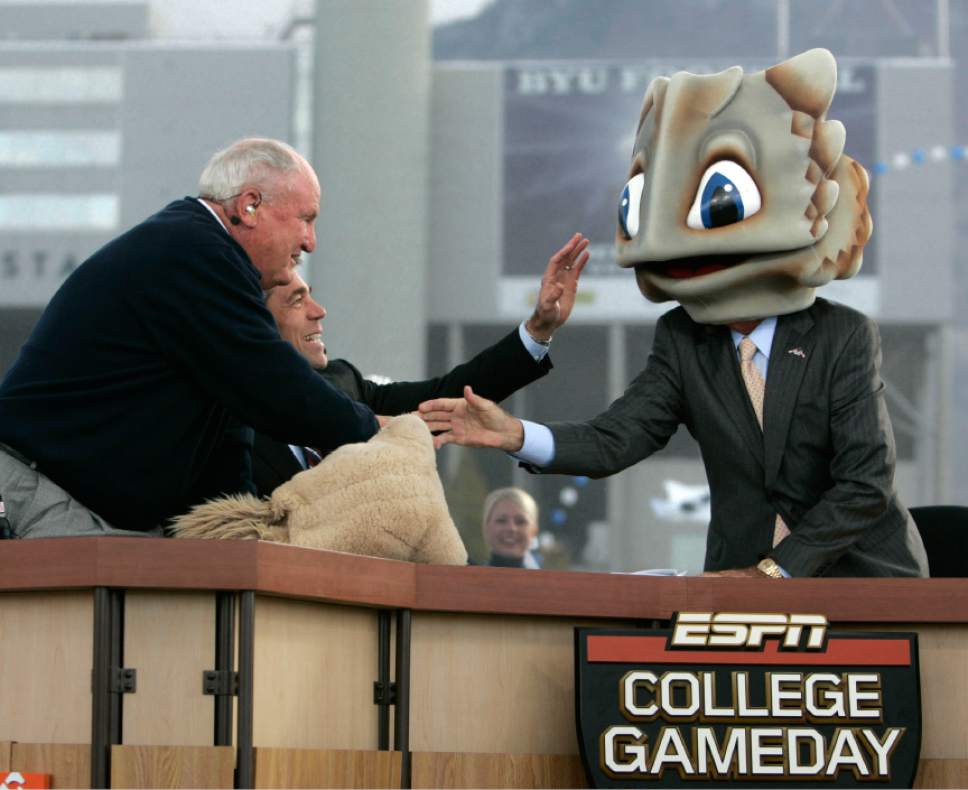 |  Tribune File Photo

Former BYU football coach LaVell Edwards, left, and ESPN's Chris Fowler, center, and ESPN's Lee Corso joke as Corso puts on a frog's head to note his game prediction during a broadcast of ESPN's College GameDay pregame show Saturday, October 24 2009 next to LaVell Edwards Stadium at Brigham Young University in Provo. Hundreds of college football fans turned out for the airing of ESPN's College GameDay pregame show prior to the BYU-TCU matchup where host Lee Corso picked the winner to be TCU.