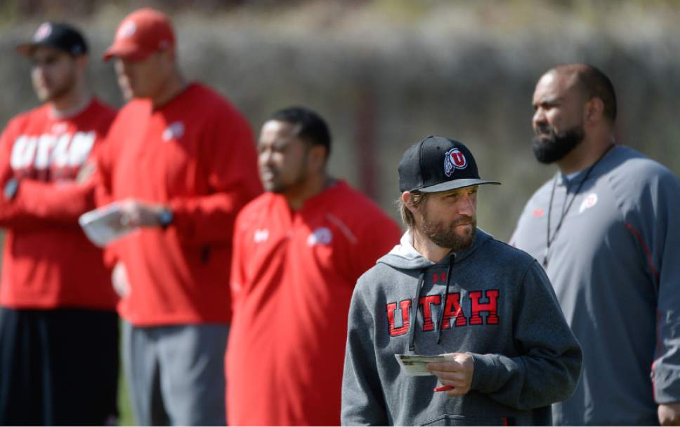 Francisco Kjolseth  |  The Salt Lake Tribune 
Aaron Roderick, bottom right, is the quiet, note-taking coach who almost never speaks during sessions outside of one-on-one conversations. Along with Jim Harding, the tallest coach on the field with a bark that is a constant presence at Utah football practice, the Utes hope this complementary pairing can do the job of offensive coordinator and bring something the Utes haven't had in years: stability.