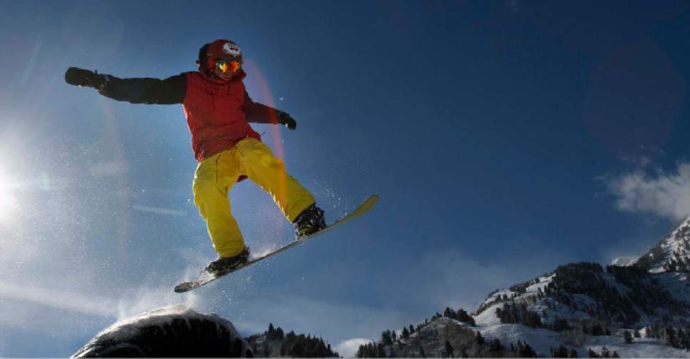 Leah Hogsten  |  Tribune file photo
A snowboarder hucks into the air at Snowbasin Ski Resort in this file photo.