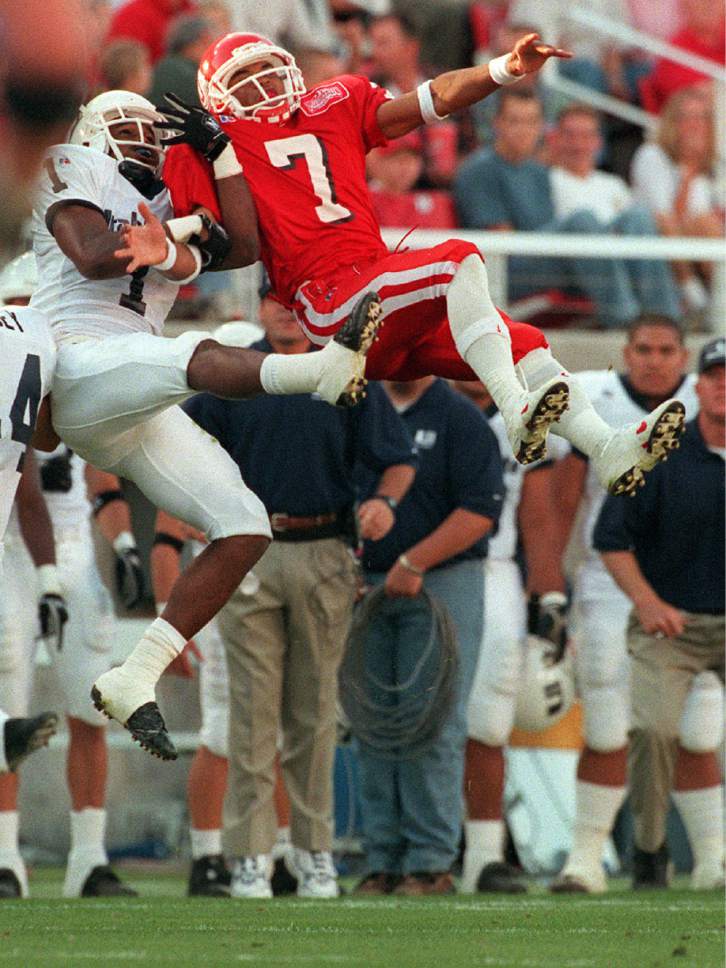 Trent Nelson  |  The Salt Lake Tribune

Utah State'sTony Walker (1) and Utah's Steve Smith (7) leap up for a Utah pass. The pass was incomplete.