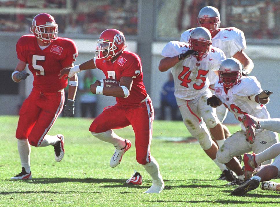 Rick Egan  |  The Salt Lake Tribune

Utes Steve Smith steps out of his shoe as he breaks a tackle on his way to a touchdown on a punt return - his second of the day on November 13, 1999.