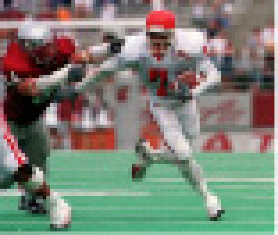 Rick Egan  |  The Salt Lake Tribune

Steve Smith breaks a tackle from Washing State linebacker Steve Gleason on his way to the end zone for a Utah touchdown.