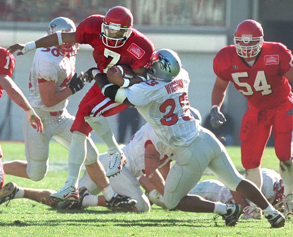 Rick Egan  |  The Salt Lake Tribune 

Utes Steve Smith breaks a tackle from New Mexico's Homon Wiggins on his way to a his second touchdown on a punt return against the Lobos on November 13, 1999.