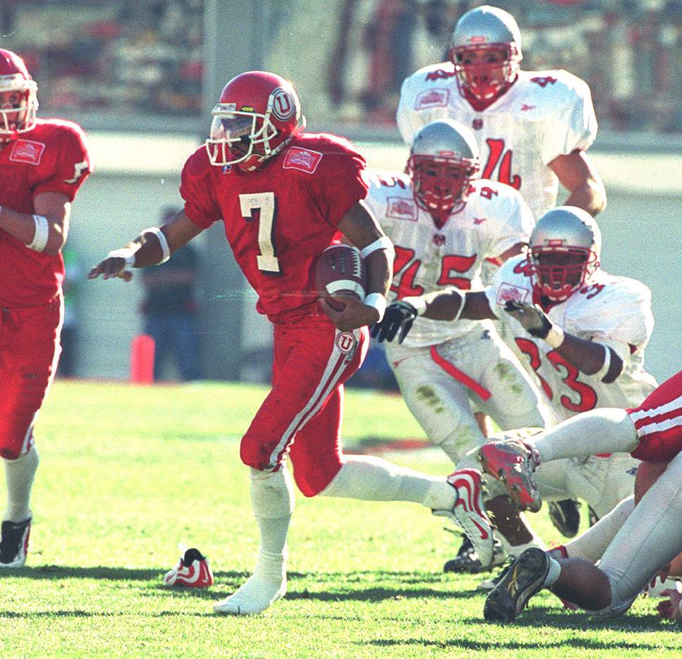 Rick Egan  |  The Salt Lake Tribune

Utes Steve Smith steps out of his shoe as he breaks a tackle on his way to a touchdown on a punt return - his second of the day on November 13, 1999.