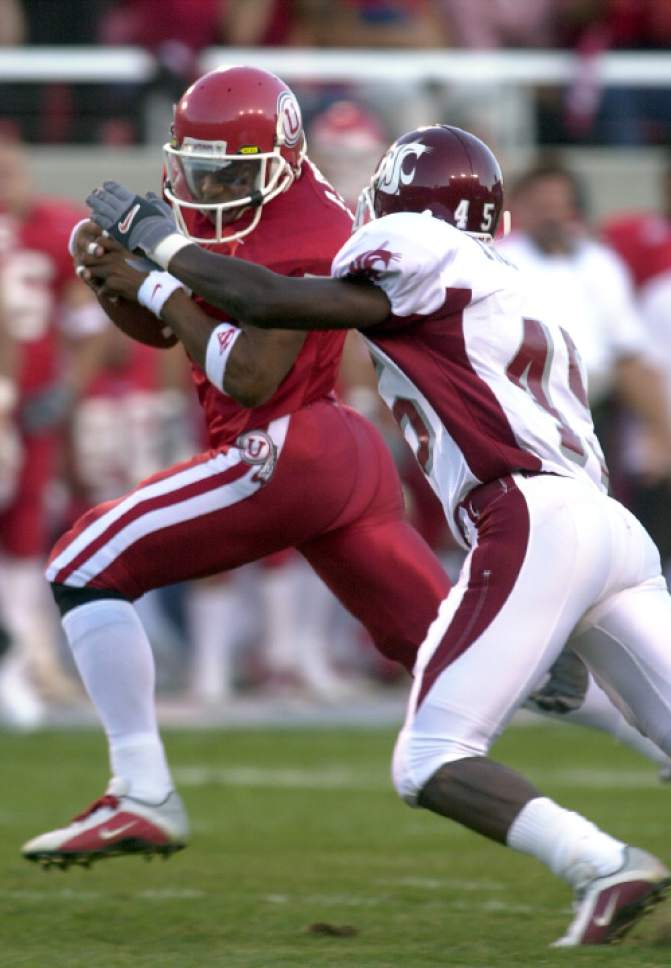 Leah Hogsten  |  The Salt Lake Tribune

University of Utah's Steve Smith out maneuvers Washington State Cougars' Marcus Trufant Saturday September 16, 2000, at Rice Eccles Stadium.