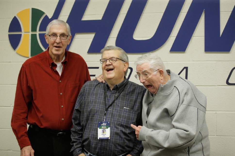 Former Utah Jazz head coaches Jerry Sloan, left, and Frank Layden, right, pose with The Salt Lake Tribune reporter Steve Luhm before an NBA basketball game Saturday, Dec. 31, 2016, in Salt Lake City. It was Luhm's last game after 37 years at the Tribune. (AP Photo/Rick Bowmer)