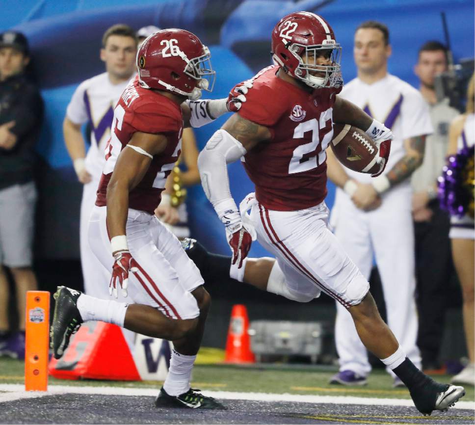 Alabama linebacker Ryan Anderson (22) runs into the end zone for a touchdown with Alabama defensive back Marlon Humphrey (26) against Washington after an interception during the first half of the Peach Bowl NCAA college football playoff game, Saturday, Dec. 31, 2016, in Atlanta. (AP Photo/John Bazemore)