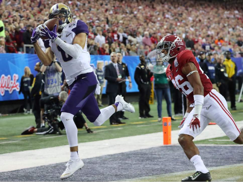 Washington wide receiver Dante Pettis gets past Alabama defensive back Marlon Humphrey for a touchdown reception  during the first quarter of the Peach Bowl NCAA college football playoff game, Saturday, Dec. 31, 2016, in Atlanta. (Curtis Compton/Atlanta Journal-Constitution via AP)