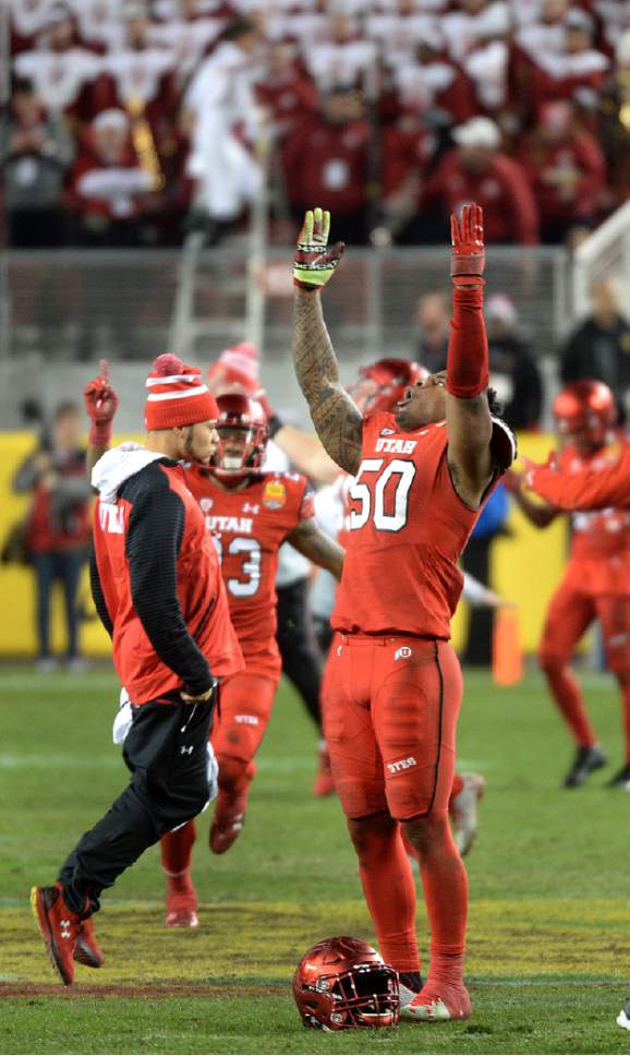 Steve Griffin / The Salt Lake Tribune

Utah Utes defensive end Pita Taumoepenu (50) holds his arms up and looks to the sky as they Utes win the Foster Farms Bowl defeating Indiana at Levi's Stadium in Santa Clara California  Wednesday December 28, 2016.