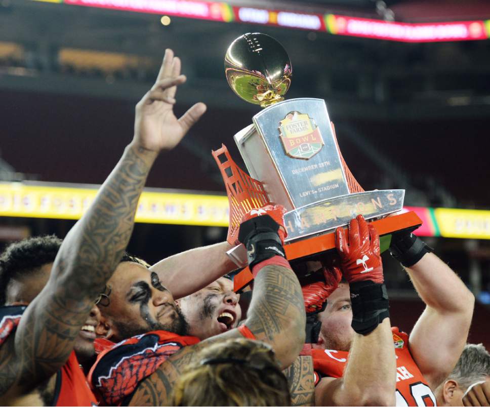 Steve Griffin / The Salt Lake Tribune

The Utah Utes hold up the championship trophy following Utah's victory in the Foster Farms Bowl at Levi's Stadium in Santa Clara California  Wednesday December 28, 2016.