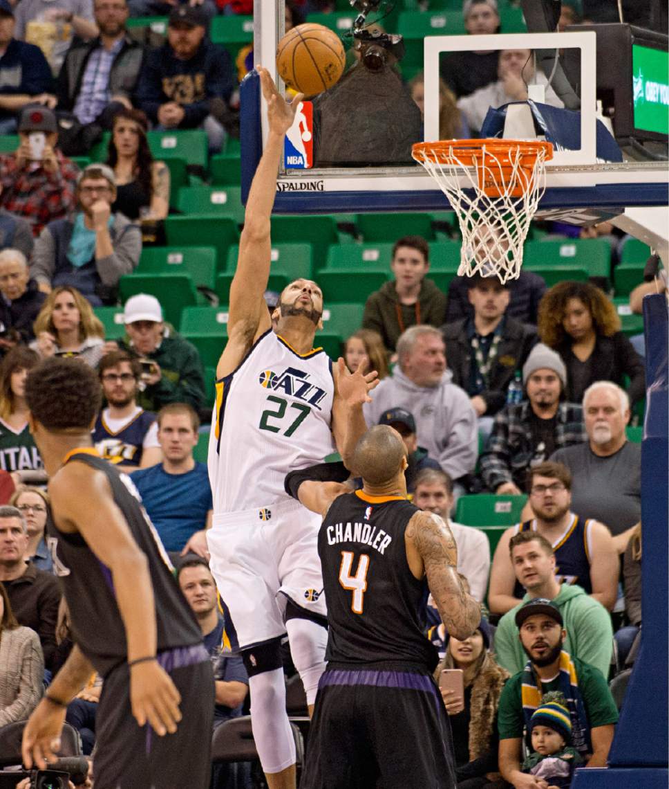 Lennie Mahler  |  The Salt Lake Tribune

Jazz center Rudy Gobert lays in two over Phoenix Suns center Tyson Chandler in the first half of a game Saturday, Dec. 31, 2016, at Vivint Smart Home Arena in Salt Lake City.