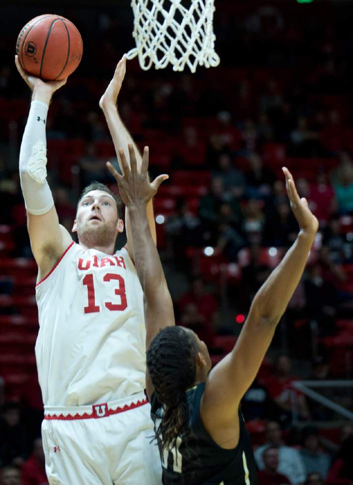 Lennie Mahler  |  The Salt Lake Tribune

Utah forward David Collette shoots over Colorado's Xavier Johnson in the first half of a  game against the Colorado Buffaloes on Sunday, Jan. 1, 2017, at the Huntsman Center in Salt Lake City.