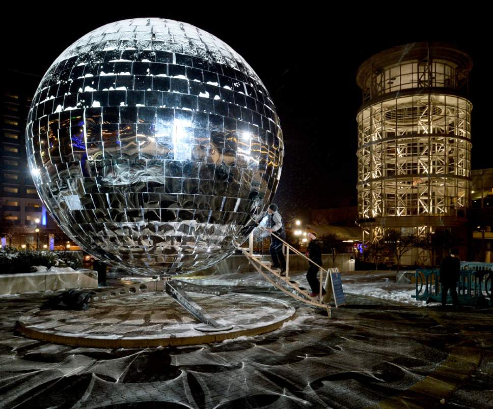 Steve Griffin  |  The Salt Lake Tribune

Visitors step inside the giant mirror ball on the south plaza of the Salt Palace Convention Center for the EVE WinterFest in 2015.
