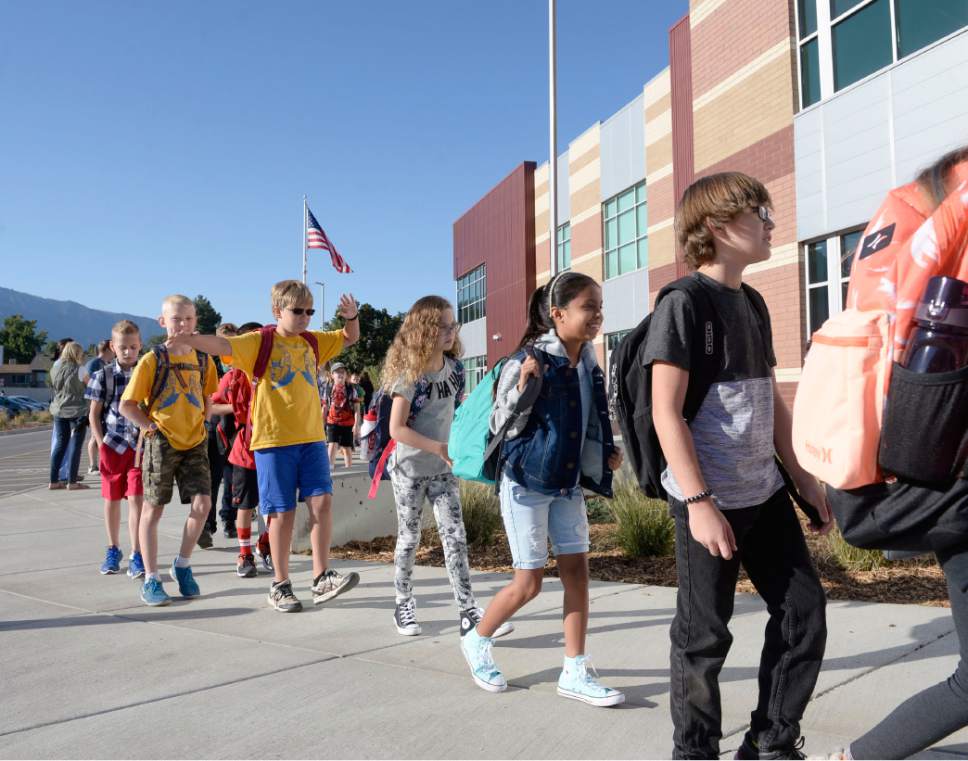 Al Hartmann  |  The Salt Lake Tribune
Students line up by classroom and march together to enter the brand new Butler Elementary in Cotonwood Heights Wenesday March 25.  It is one of hundreds of schools that opened Wednesday as students gear up for the 2016-2017 school year.