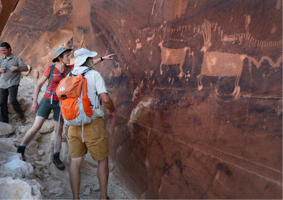 Scott Sommerdorf   |  Tribune file photo
U.S. Interior Secretary Sally Jewell talks with Vaughn Hadenfeldt about ancient petroglyphs - some of which have been vandalized -  near Comb Ridge, Saturday, July 16, 2016.