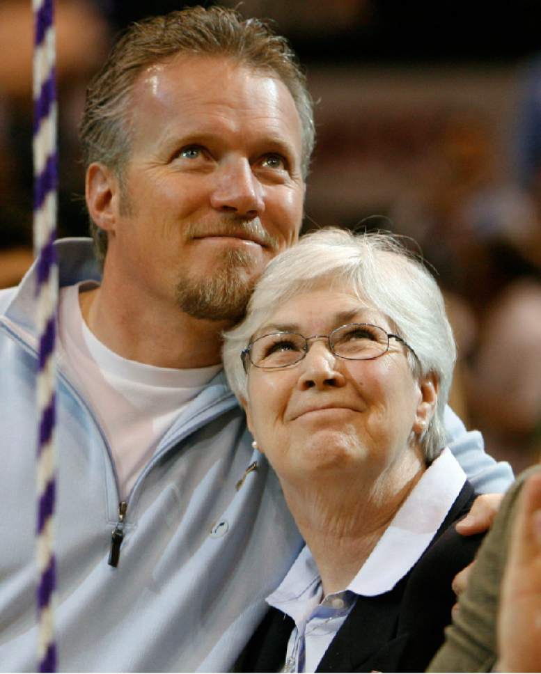 Steve Griffin  |  The Salt Lake Tribune

Greg Miller hugs Gail Miller, his mother, after a Larry Miller jersey was unveiled in the rafters of EnergySolutions Arena during a halftime presentation Wednesday.