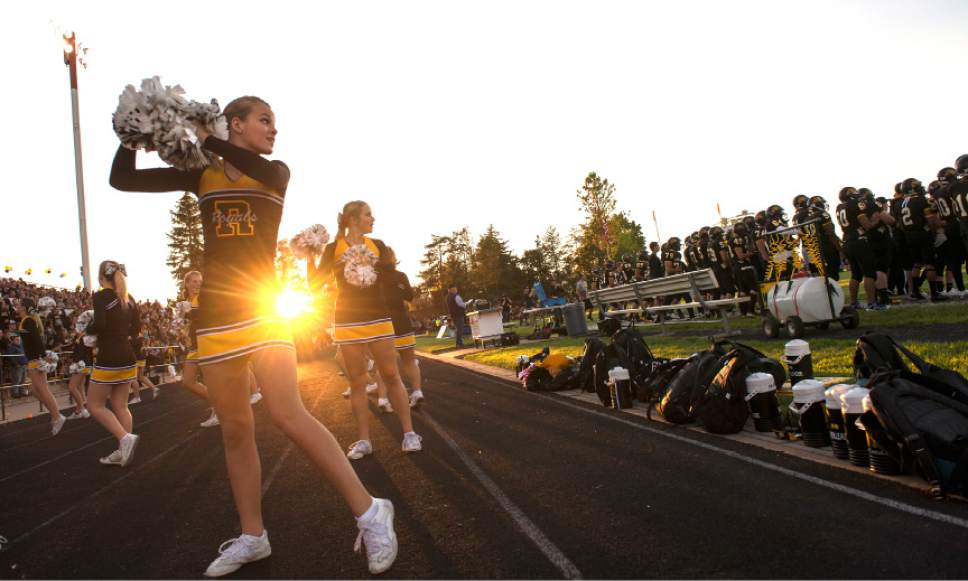 Leah Hogsten  |  The Salt Lake Tribune
Roy High School cheerleader Libbie Miles looks to the field as the Royals crowd roars at the gain of yards on the field. Roy High School defeated Fremont High School 27-20 during their Region 1 game, Friday, September 16, 2016 in Roy.