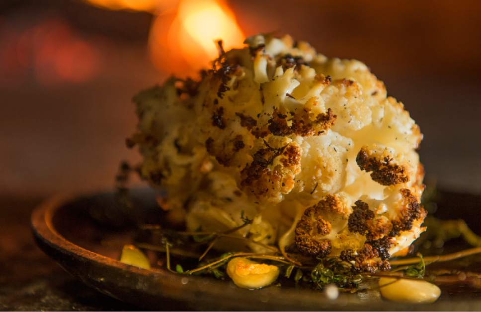 Leah Hogsten  |  The Salt Lake Tribune
Cauliflower is being called the new kale for 2017. Briar Handly, chef at HSL in Salt Lake City and Handle in Park City, is blazing the cauliflower trail among Utah chefs. His latest variation is "Hearth Roasted Cauliflower," a whole head of cauliflower that has been roasted and basted in a wood-fired oven at 700 degrees for almost three hours.