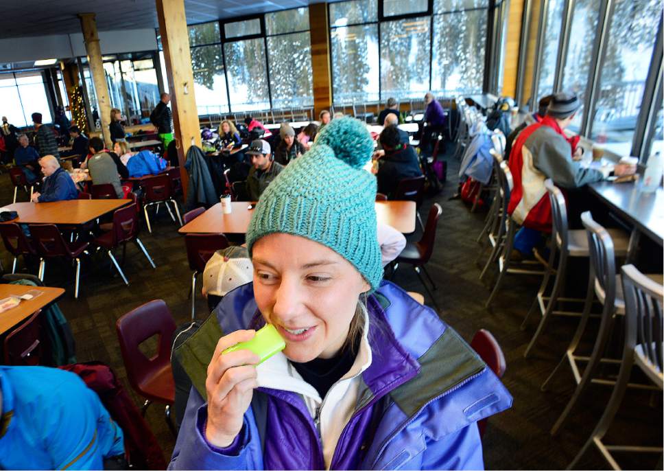Scott Sommerdorf   |  The Salt Lake Tribune  
Molly Morgan, visiting from Minnesota, applies sunscreen  at the Albion Grill, in preparation for her New Years Day ski at Alta, Sunday, January 1, 2017.