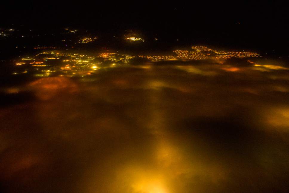 Chris Detrick  |  The Salt Lake Tribune
A pollution inversion over the Salt Lake Valley as seen from an airplane returning to Salt Lake International Airport Friday December 30, 2016.