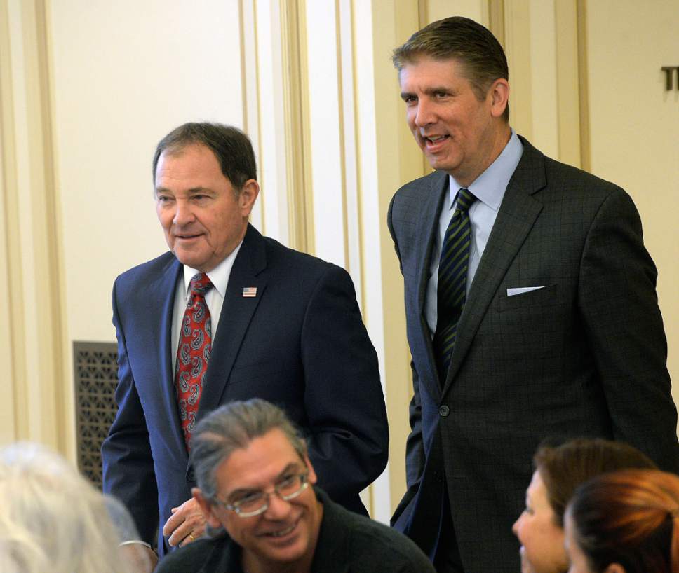 Al Hartmann  |   Tribune file photo
Utah Valley University President Matthew Holland, right, with Gov. Gary Herbert in January, emerged at the top of a survey gauging strength of potential 3rd Congressional District candidates to replace Rep. Jason Chaffetz.