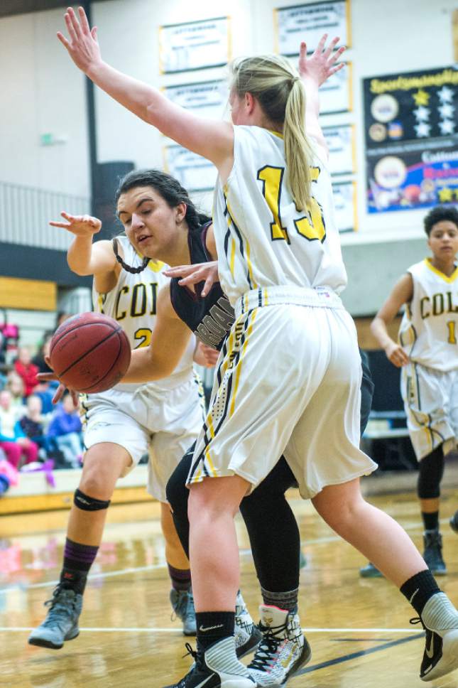 Chris Detrick  |  The Salt Lake Tribune
Jordan's Morgan Sterner #32 is guarded by Cottonwood's Aimee Preece #15 during the game at Cottonwood High School Thursday January 5, 2017.