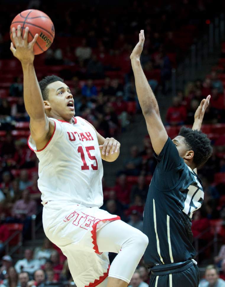 Lennie Mahler  |  The Salt Lake Tribune

Utah guard Lorenzo Bonam shoots over Colorado's Dominique Collier in the second half of a game against the Colorado Buffaloes on Sunday, Jan. 1, 2017, at the Huntsman Center in Salt Lake City.