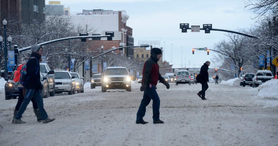 Al Hartmann  |  The Salt Lake Tribune
Drivers and pedestrians endure a slow and go commute on snow-packed streets in downtown Salt Lake City Thursday Jan. 5.