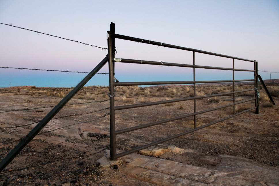 Rick Egan  |  The Salt Lake Tribune

New owners of a former state trust section have locked this gate to a county road crossing the now private land near Comb Ridge. The spot, a few miles west of Bluff, is in the newly designated Bears Ears National Monument.