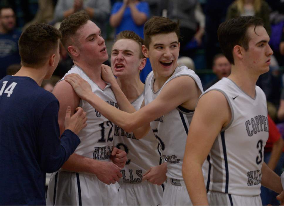 Leah Hogsten  |  The Salt Lake Tribune
Copper Hills players celebrate with Stockton Shorts who sunk a 3-pointer in the last moments of the game to clinch the win.  Copper Hills High School defeated Bingham High School 59-57 during their game that went into overtime Friday, January 6, 2017 at Copper Hills.